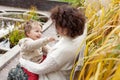 Happy mother and her little child. Smiling child playing with mother in the park. Mother and son embracing Royalty Free Stock Photo