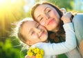 Happy mother and her little daughter outdoor. Mom and daughter enjoying nature together in green park Royalty Free Stock Photo