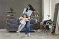 Happy mother and her little daughter playing games and having lots of fun together Royalty Free Stock Photo