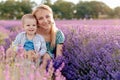 Happy mother and her little son phaving fun in a lavender field Royalty Free Stock Photo