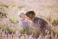 Happy mother and her little son posing in a lavender field Royalty Free Stock Photo