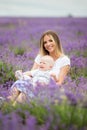 Happy mother and her little son posing in a lavender field Royalty Free Stock Photo