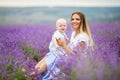 Happy mother and her little son posing in a lavender field Royalty Free Stock Photo