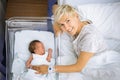 Happy mother with her newborn baby boy still in the hospital Royalty Free Stock Photo