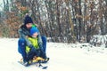 Happy mother and her son enjoying sleigh ride. Happy family with sled in winter having fun together. Child sledding. Family drivin Royalty Free Stock Photo