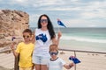 Happy mother with her sons holding Australian flags in hands on Australia Day Royalty Free Stock Photo