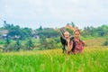 Happy mother hold little baby in hiking backpack carrier