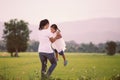 Happy mother holding her kid and spinning around with fun Royalty Free Stock Photo