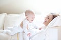 Happy mother holding her lovely smiling baby Royalty Free Stock Photo