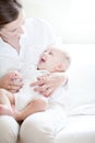 Happy mother holding her lovely smiling baby Royalty Free Stock Photo