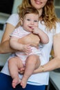 Happy mother holding a baby in her arms Royalty Free Stock Photo