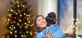 Happy mother hugging her daughter on christmas Royalty Free Stock Photo