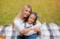 Happy Mother Hugging Her Little Daughter During Picnic In Countryside Royalty Free Stock Photo