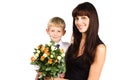 Happy mother hugging her son with flowers Royalty Free Stock Photo