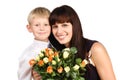 Happy mother hugging her son with flowers Royalty Free Stock Photo