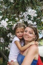 happy mother hugs crying daughter and calms her down