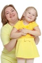 A happy mother hugs her beloved daughter. Royalty Free Stock Photo