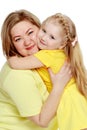 A happy mother hugs her beloved daughter. Royalty Free Stock Photo