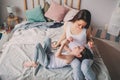 Mother and child son enjoying weekend morning in bed, casual lifestyle Royalty Free Stock Photo