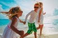 Happy mother and kids enjoy beach vacation, family have fun