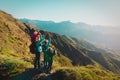 Happy mother with kids travel in sunset mountains, family hiking in nature Royalty Free Stock Photo