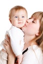 Happy mother kisses baby Royalty Free Stock Photo