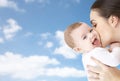 Happy mother kissing adorable baby Royalty Free Stock Photo