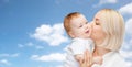 Happy mother kissing adorable baby Royalty Free Stock Photo