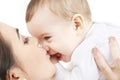 Happy mother kissing baby boy Royalty Free Stock Photo