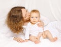 Happy mother kissing baby at home Royalty Free Stock Photo