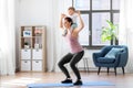 Happy mother with little baby exercising at home Royalty Free Stock Photo