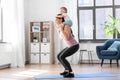 Happy mother with little baby exercising at home Royalty Free Stock Photo