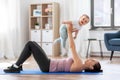 Happy mother with little baby exercising at home Royalty Free Stock Photo