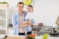 Happy mother and little baby girl at home kitchen Royalty Free Stock Photo