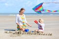 Happy mother and little child playing on the beach Royalty Free Stock Photo