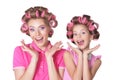 Happy mother and little daughter with hair curlers isolated on white background Royalty Free Stock Photo