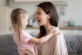 Happy mother and little daughter hugging, having fun together Royalty Free Stock Photo