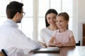 Happy mother with little daughter visiting pediatrician in clinic Royalty Free Stock Photo