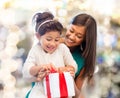 Happy mother and little girl with gift box Royalty Free Stock Photo