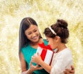 Happy mother and little girl with gift box Royalty Free Stock Photo