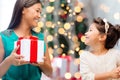 Happy mother and little girl with gift box Royalty Free Stock Photo