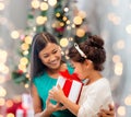 Happy mother and little girl with gift box Royalty Free Stock Photo