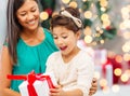 Happy mother and little girl with gift box Royalty Free Stock Photo