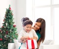 Happy mother and little girl with gift box Royalty Free Stock Photo