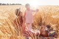 Happy mother looking at her daughter, holding her with hands, smiling sincerely, enjoying family rest, spending time with pleasure Royalty Free Stock Photo