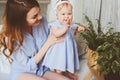 Happy mother and 9 month old baby in matching pajamas playing in bedroom in the morning Royalty Free Stock Photo