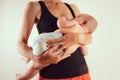 Happy mother with newborn baby infant on hands standing and breasfeeding lacting lactation health and care bonding time Royalty Free Stock Photo