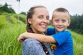 Happy mother playing with her son in the park Royalty Free Stock Photo