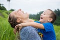 Happy mother playing with her son in the park Royalty Free Stock Photo