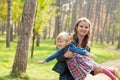 Happy mother playing with his daughter in the park  in summer day Royalty Free Stock Photo